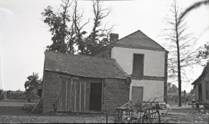 <b>Caption:</b>  Brick house near Danville abandoned on account of danger by room-and-pillar mining of a 6-foot coal at a depth of about 200 feet.<br><b>Credit:</b>  Illinois State Geological Survey<br><b>Date:</b>  Pre-1914<br><b>Publication:</b>  Fig. 42 Cooperative Bulletin 17 – Subsidence in Illinois<br><b>Library No.:</b>  M-1007