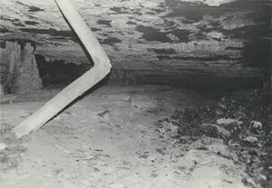 <b>Caption:</b>  Floor heaving: 7' vertical opening was closed to only a few feet. Wooden posts which were set when the squeeze first started broke.<br><b>Date:</b>  07/11/1972<br>