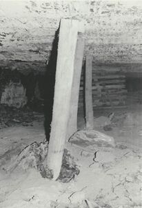 <b>Caption:</b>  Floor heaving: 7' vertical opening was closed to only a few feet. Wooden posts which were set when the squeeze first started broke or were pused into the underclay whiched heaved and broke around them.<br><b>Date:</b>  07/11/1972<br>