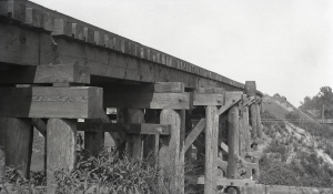 <b>Caption:</b>  Repaired railroad trestle in Franklin County. One end subsided 18 inches more than the other, the total having been reported is about 4 feet.<br><b>Credit:</b>  Illinois State Geological Survey<br><b>Date:</b>  Pre-1914<br><b>Publication:</b>  Fig. 40 Cooperative Bulletin 17 – Subsidence in Illinois<br><b>Library No.:</b>  M-992