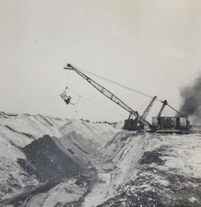 <b>Caption:</b>  Surface mine pit, NE 30-T6N-R3E, dragline.  Photographer G. Cady<br><b>Credit:</b>  Illinois State Geological Survey<br><b>Date:</b>  6-25-1941<br><b>Library No.:</b>  2316 (M-1513)