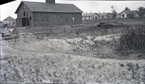 <b>Caption:</b>  Barn of mining company lowered 4 feet at one end [right side]. It has been partially restored.<br><b>Credit:</b>  Illinois State Geological Survey<br><b>Date:</b>  Pre-1914<br><b>Library No.:</b>  M-993